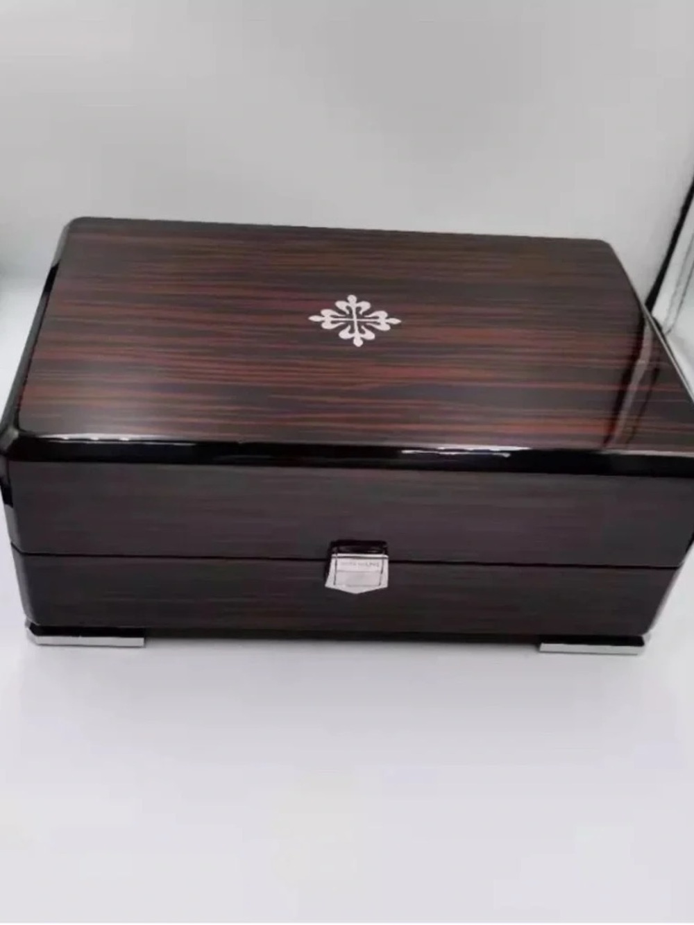 Patek Philippe Brown and Black High-Gloss Wood Watch Box with Silver Emblem